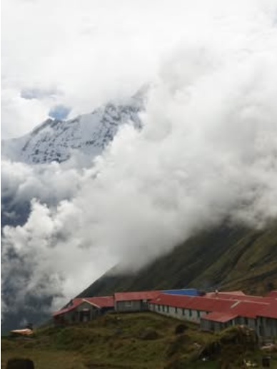 Lodge Exterior & Red Roofs in the Himalayan Mist
